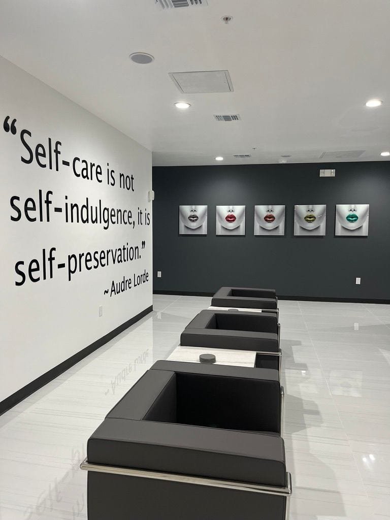 "Self-Care is not self-indulgence, it is self-preservation" quote on the wall.